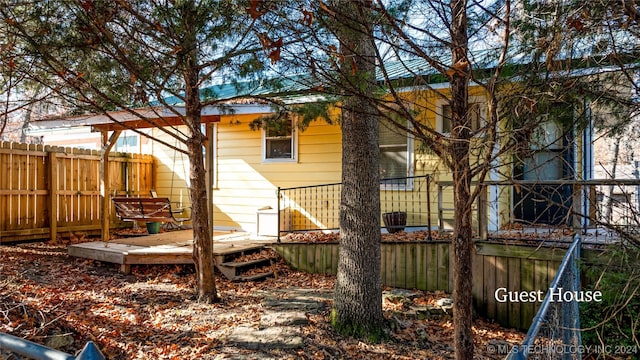 rear view of house with a deck