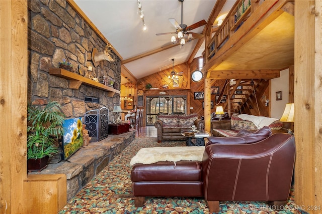 living room featuring ceiling fan, a stone fireplace, high vaulted ceiling, beamed ceiling, and wooden walls