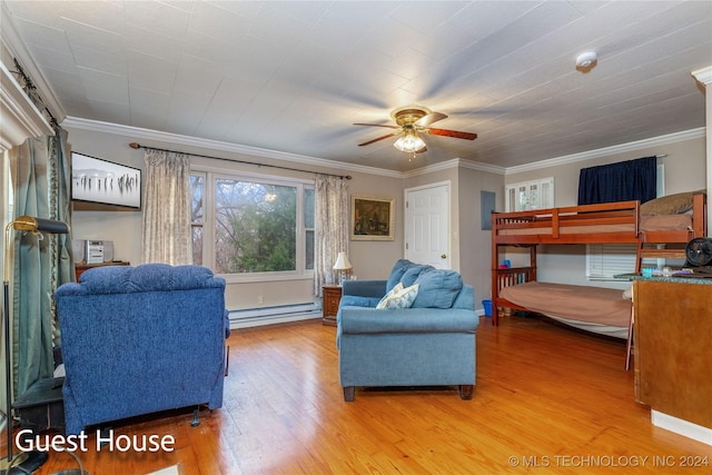 bedroom with hardwood / wood-style flooring, ceiling fan, ornamental molding, and a baseboard radiator