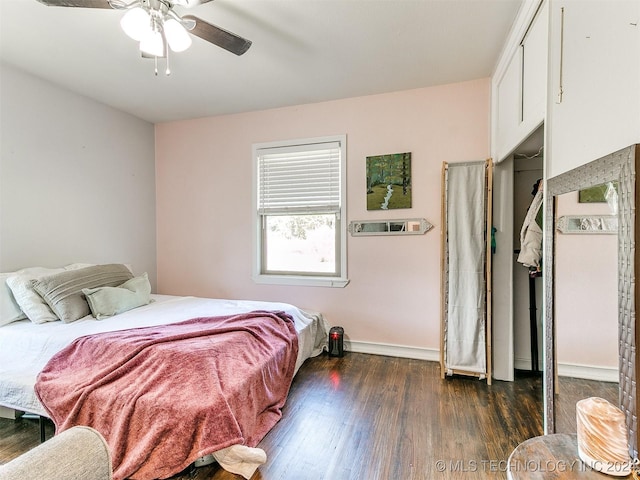 bedroom with ceiling fan and dark wood-type flooring