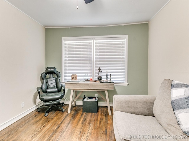 office space with hardwood / wood-style flooring, ceiling fan, and ornamental molding