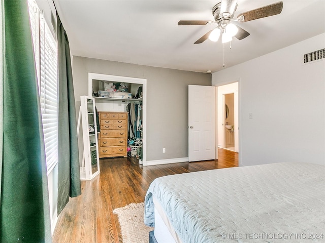 bedroom featuring hardwood / wood-style flooring, ceiling fan, and a closet