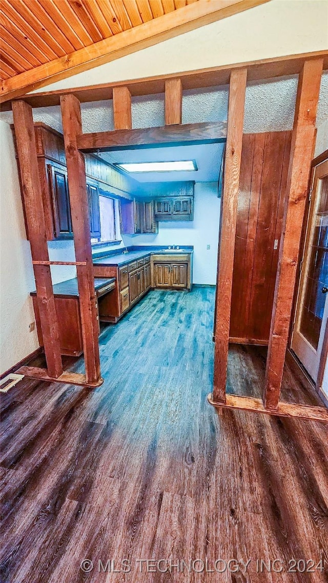 kitchen with dark hardwood / wood-style floors and beam ceiling