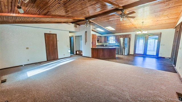 unfurnished living room with ceiling fan with notable chandelier, wooden ceiling, dark carpet, and vaulted ceiling with beams