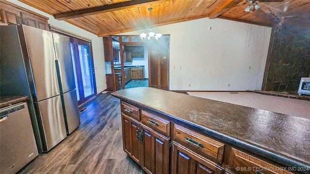 kitchen with appliances with stainless steel finishes, lofted ceiling with beams, dark hardwood / wood-style flooring, a chandelier, and wood ceiling