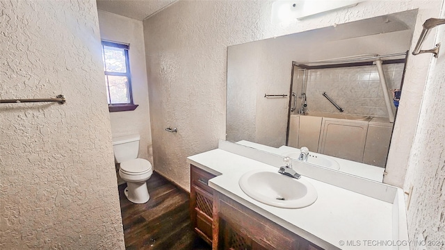 bathroom with vanity, hardwood / wood-style floors, and toilet