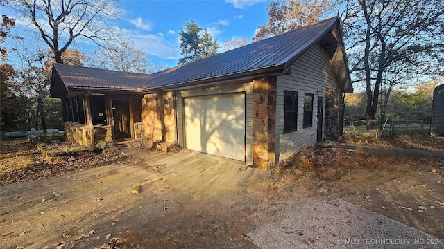 view of side of property featuring a garage