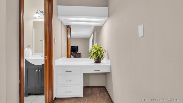 bathroom featuring tile patterned flooring and vanity