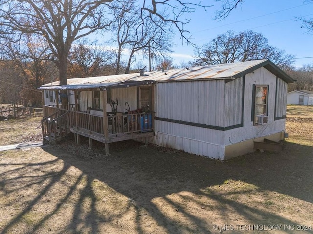 rear view of house with covered porch