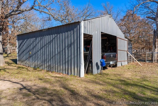 view of outbuilding with a yard