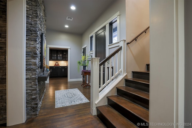 foyer entrance with dark hardwood / wood-style flooring