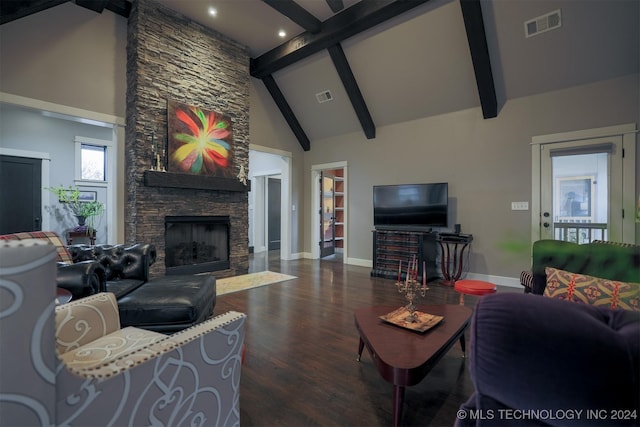 living room with dark hardwood / wood-style floors, beam ceiling, a fireplace, and high vaulted ceiling