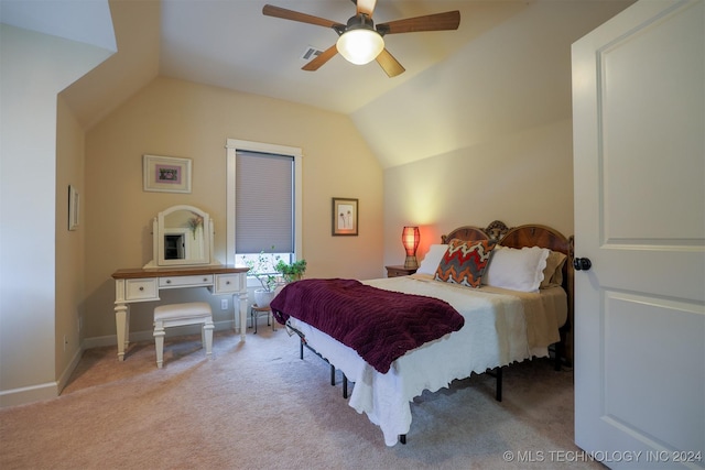 bedroom with ceiling fan, light colored carpet, and lofted ceiling