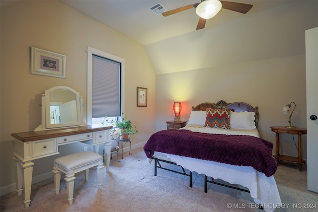 bedroom featuring light carpet, vaulted ceiling, and ceiling fan