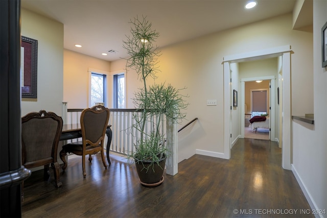 hall with dark wood-type flooring