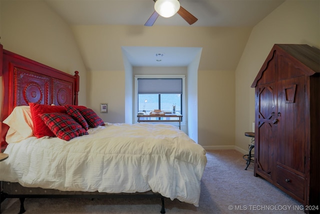 carpeted bedroom with ceiling fan and lofted ceiling