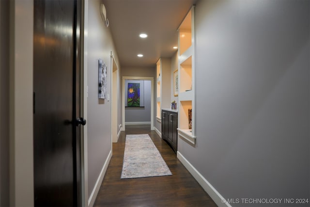 hallway featuring dark hardwood / wood-style floors