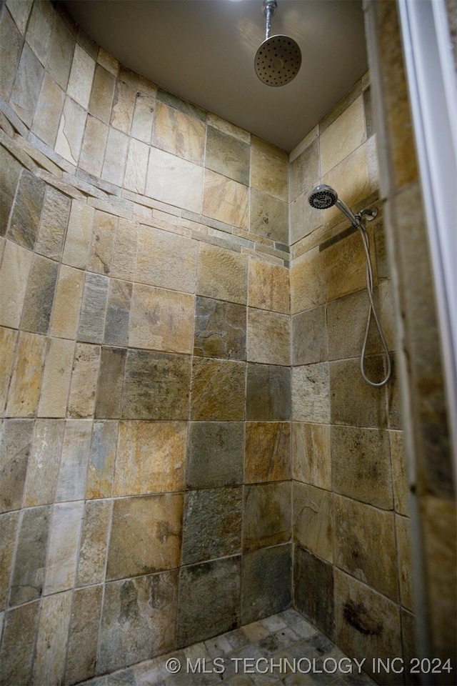 bathroom with tiled shower