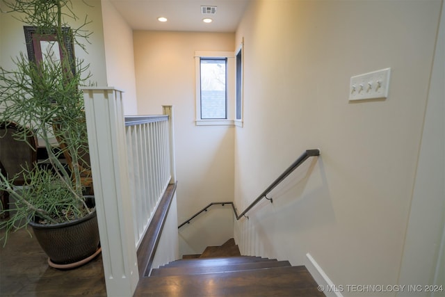 staircase featuring hardwood / wood-style flooring