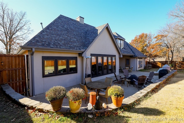 back of property with a patio area