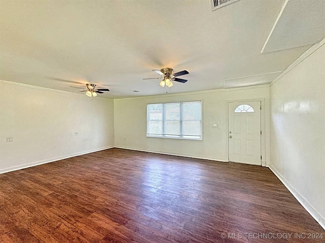 foyer featuring ceiling fan, dark hardwood / wood-style flooring, ornamental molding, and a textured ceiling