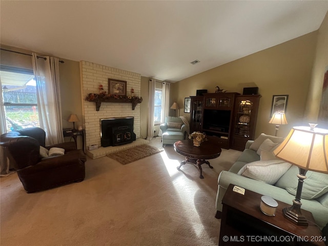 living room with light colored carpet, plenty of natural light, and lofted ceiling