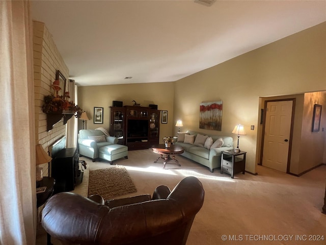 carpeted living room with a fireplace