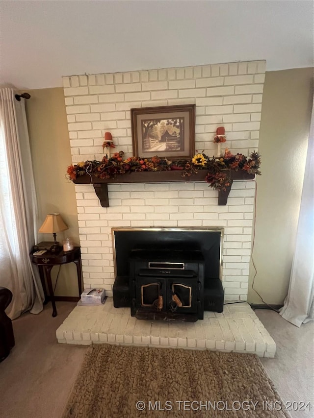 interior details with carpet flooring and a wood stove