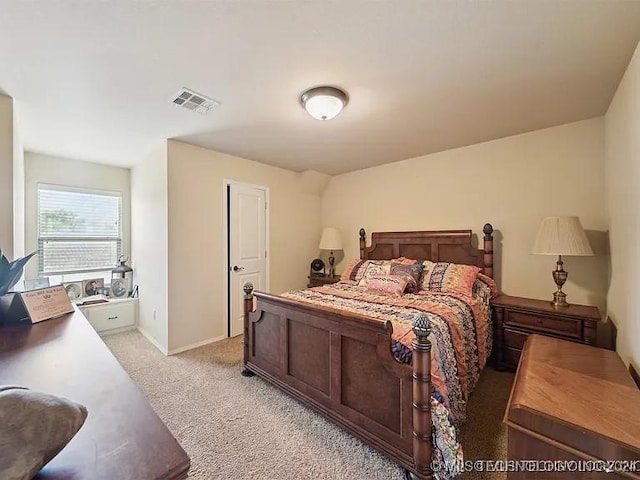 bedroom with light colored carpet