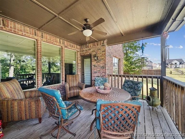 deck featuring an outdoor living space and ceiling fan