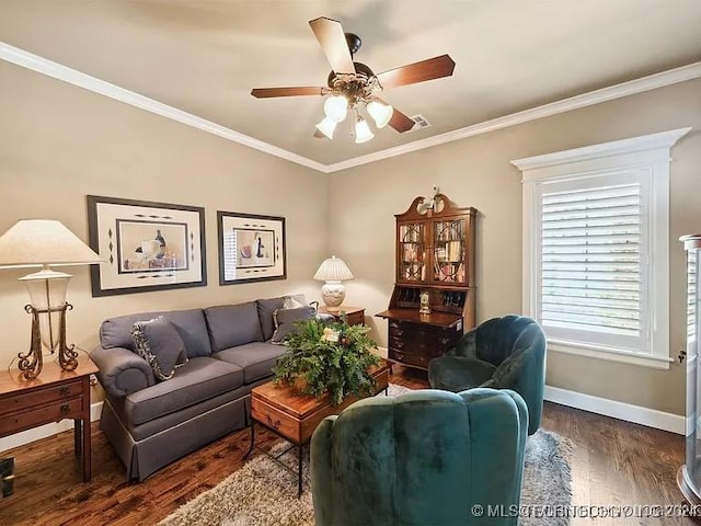 living room featuring dark hardwood / wood-style floors, ceiling fan, and ornamental molding