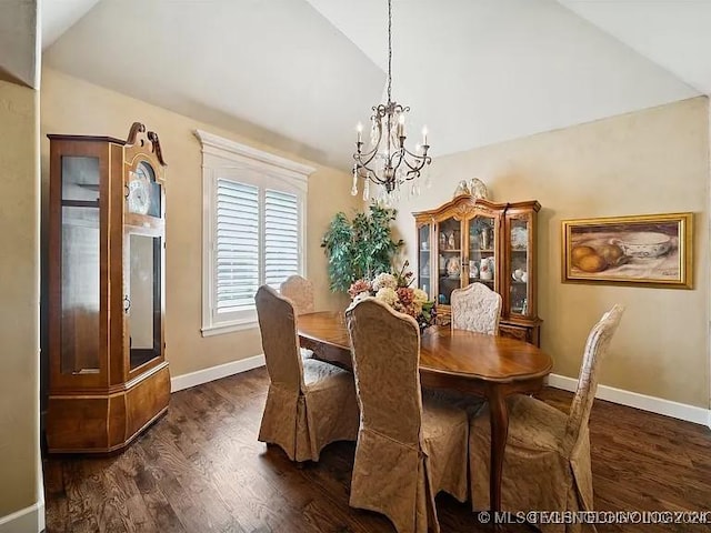 dining room featuring dark hardwood / wood-style flooring, vaulted ceiling, and an inviting chandelier