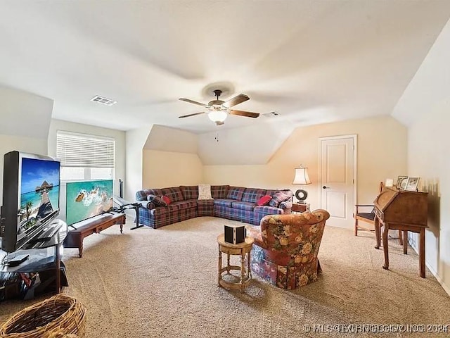 living room featuring carpet flooring, ceiling fan, and vaulted ceiling