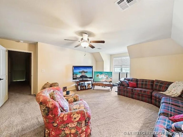 carpeted living room featuring ceiling fan and lofted ceiling