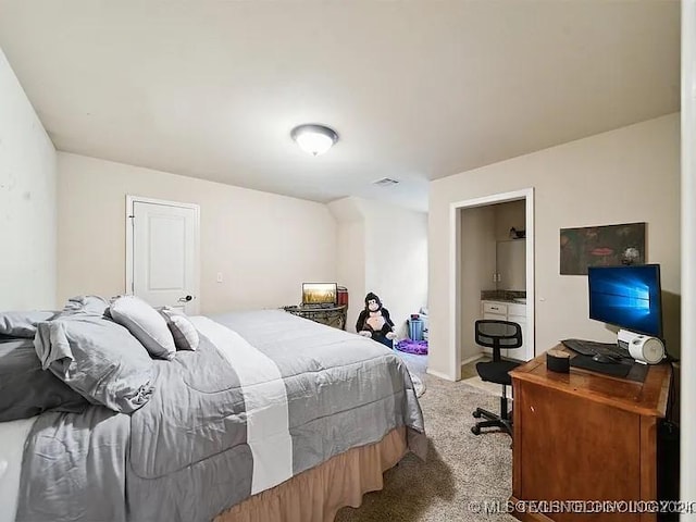 bedroom featuring light carpet