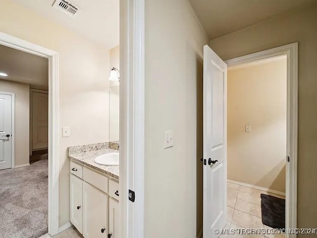 bathroom featuring tile patterned floors and vanity