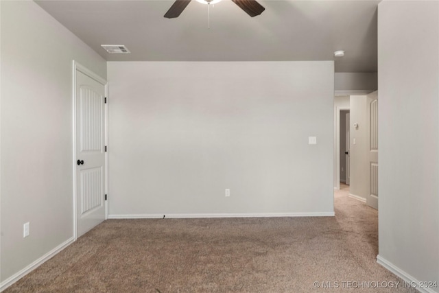 carpeted empty room with ceiling fan