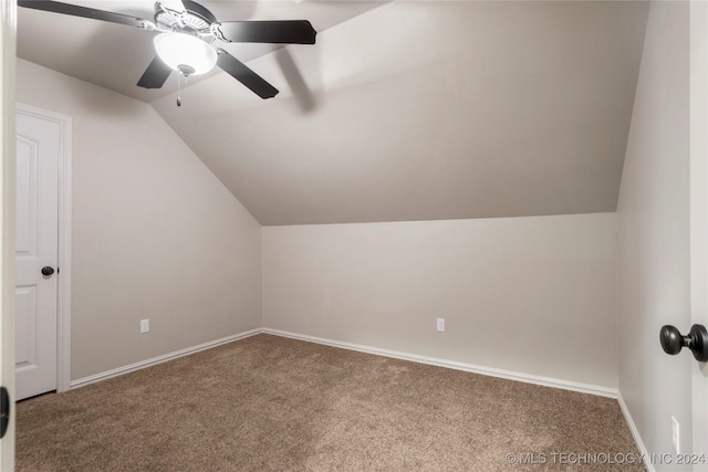 additional living space featuring ceiling fan, carpet floors, and vaulted ceiling