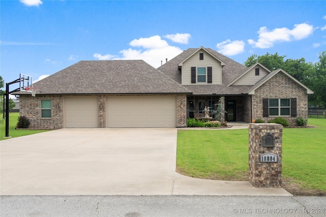 craftsman house with a front lawn and a garage