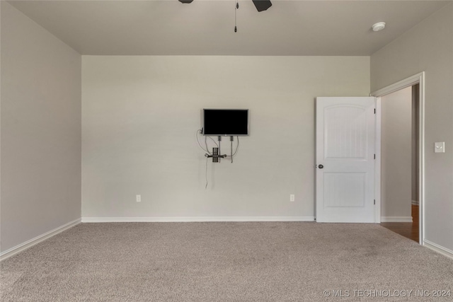 carpeted empty room with ceiling fan