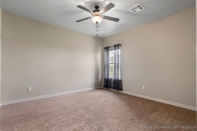 empty room featuring carpet and ceiling fan