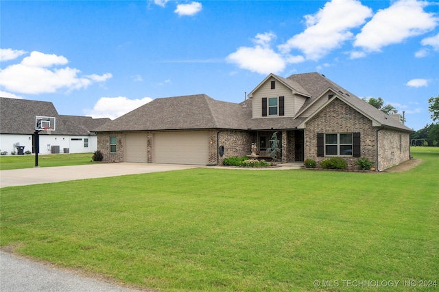 view of front of property with a garage and a front yard