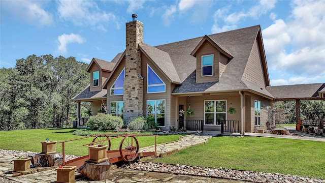 rear view of property featuring a lawn