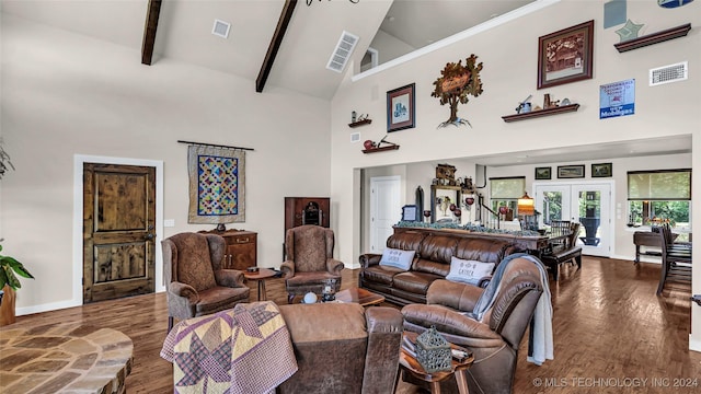 living room with beamed ceiling, dark hardwood / wood-style flooring, high vaulted ceiling, and french doors