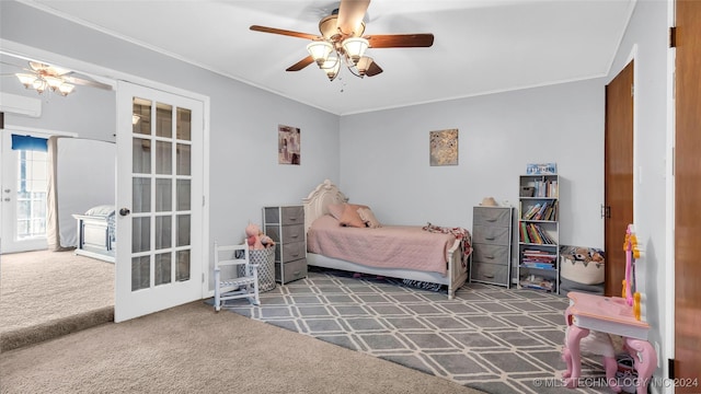 bedroom featuring carpet flooring, french doors, a wall mounted air conditioner, ornamental molding, and ceiling fan