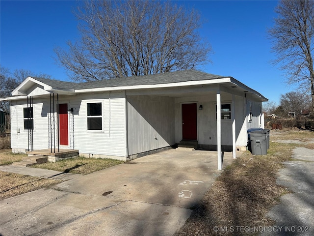 view of front of house with a carport