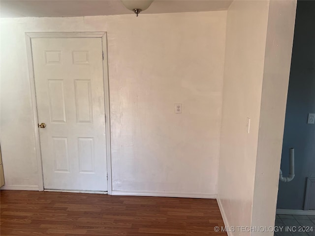 empty room with dark wood-type flooring