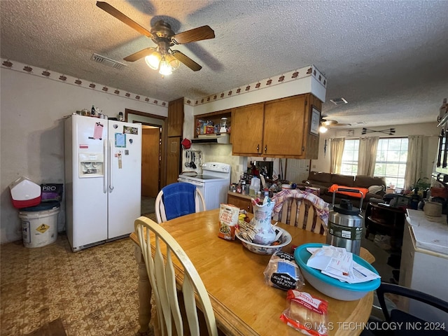 dining space featuring a textured ceiling, washer / clothes dryer, and ceiling fan