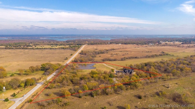 aerial view with a rural view and a water view