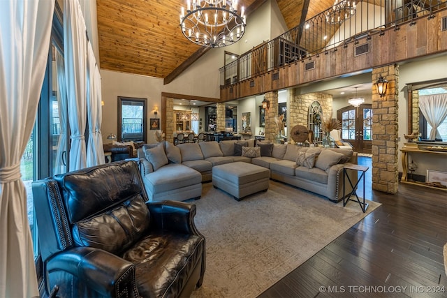 living room featuring wood ceiling, dark hardwood / wood-style flooring, ornate columns, and high vaulted ceiling